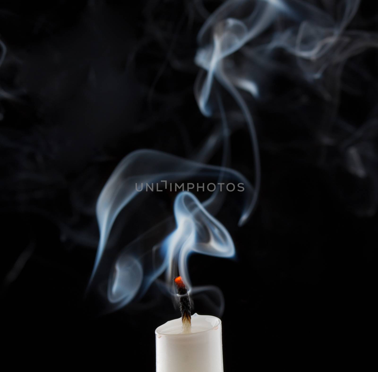 Extinguished candle with smoke by ozaiachin