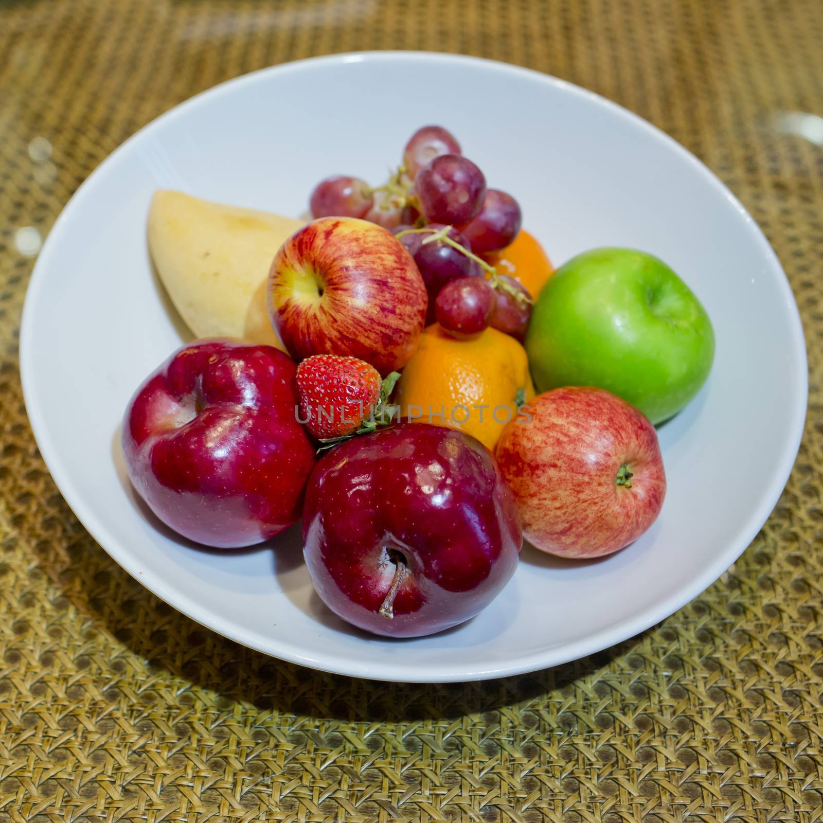 Mix fresh fruits in white dish