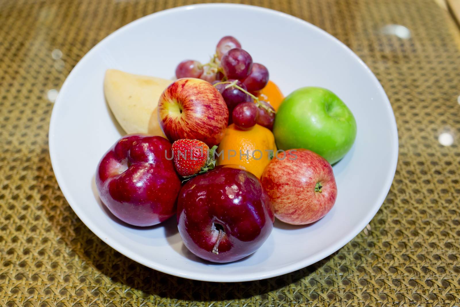 Mix fresh fruits in white dish