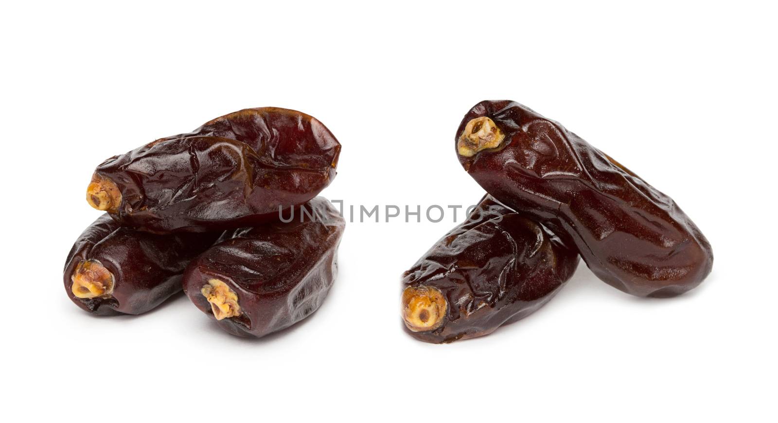 Fresh dates over white background by ozaiachin