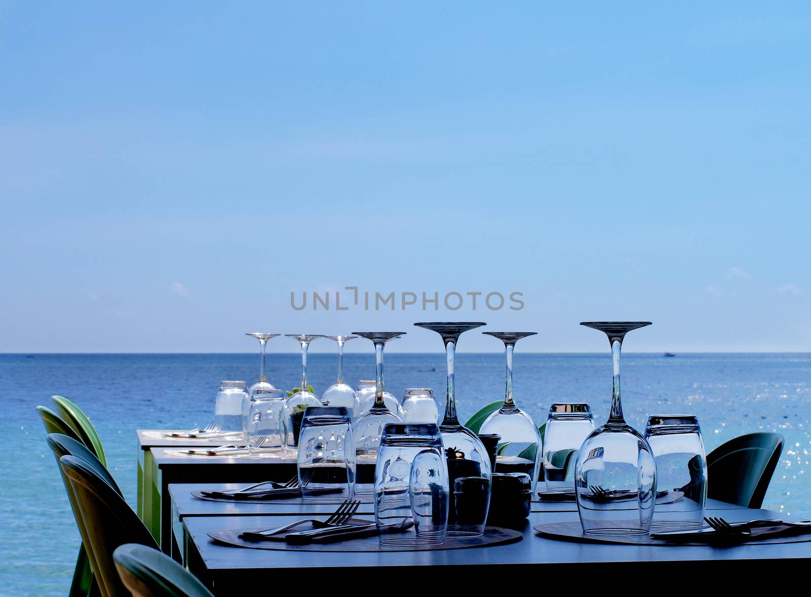 Served Restaurant Tables on Sea Coast by zhekos