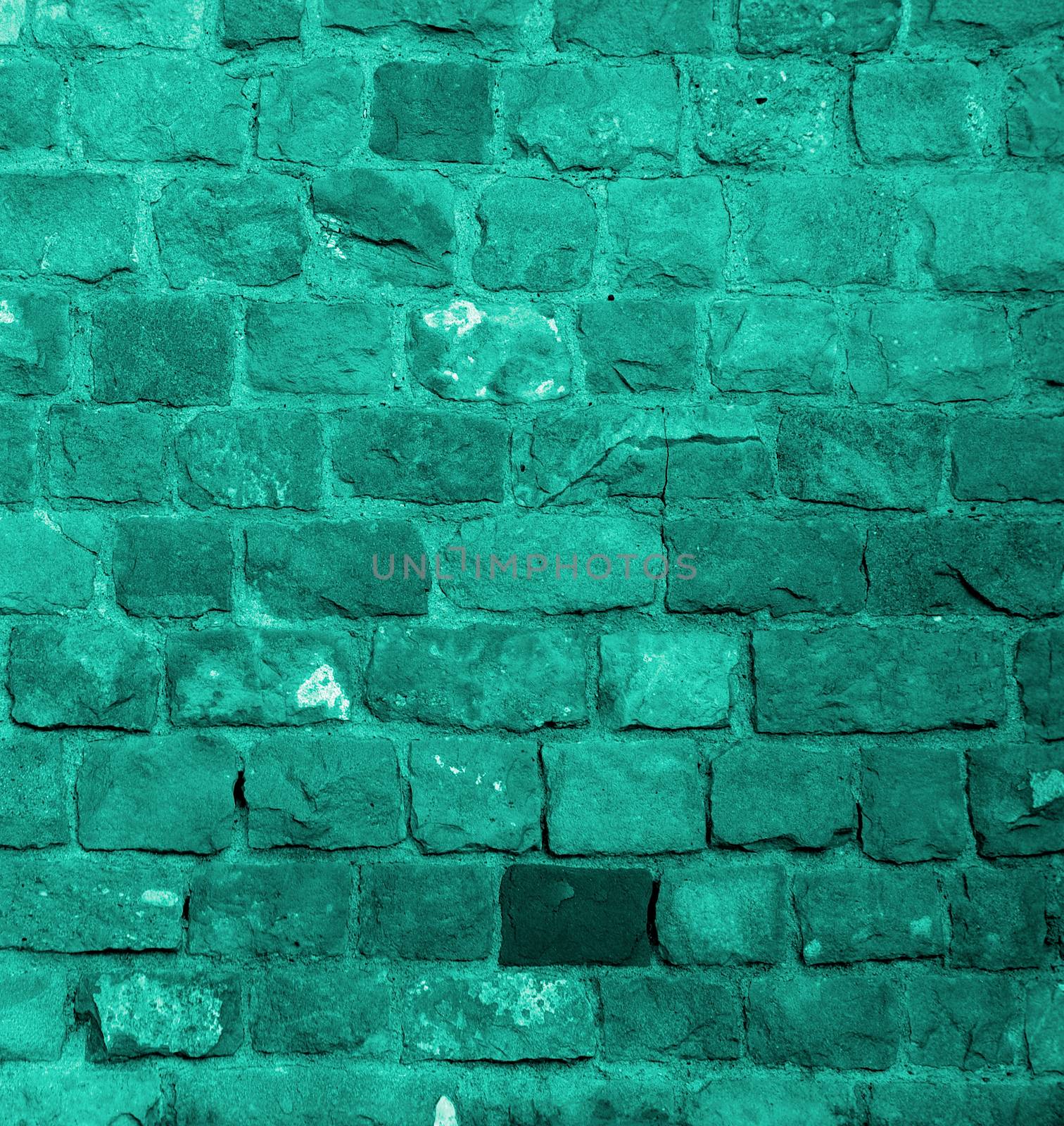 Background of Turquoise Old Damaged Bricks with Concrete Smoothing closeup