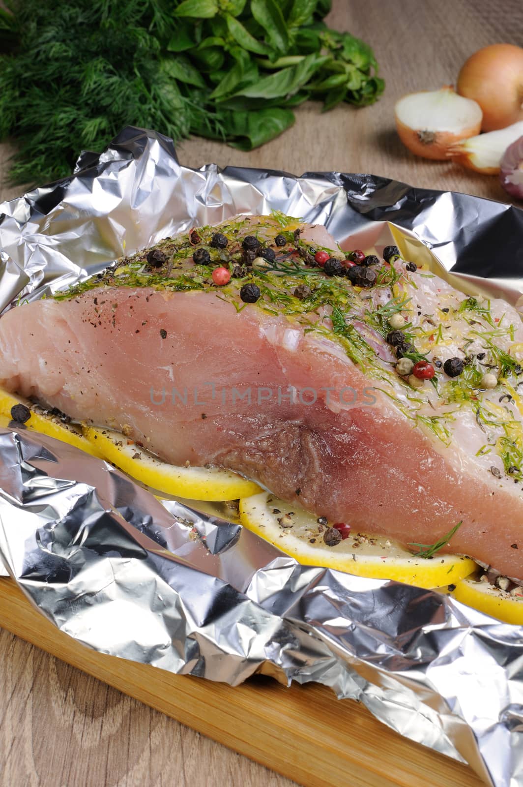 A piece of raw carp in foil by Apolonia