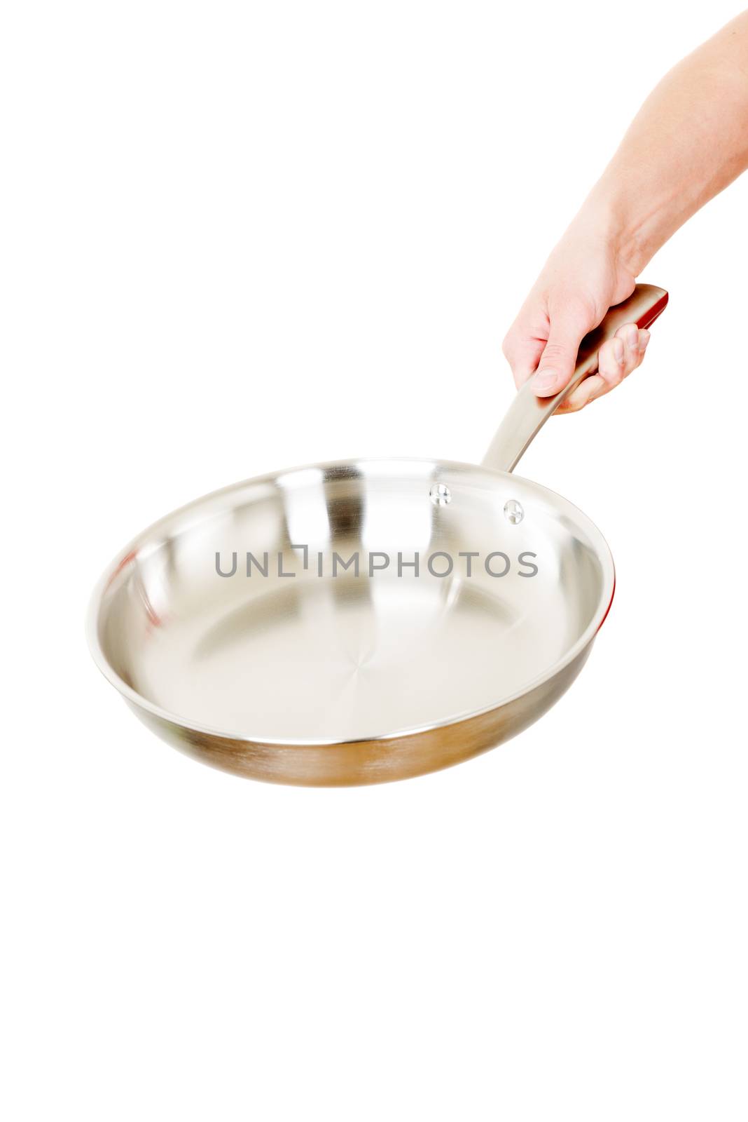 Steel frying pan hold by hand isolated on white background