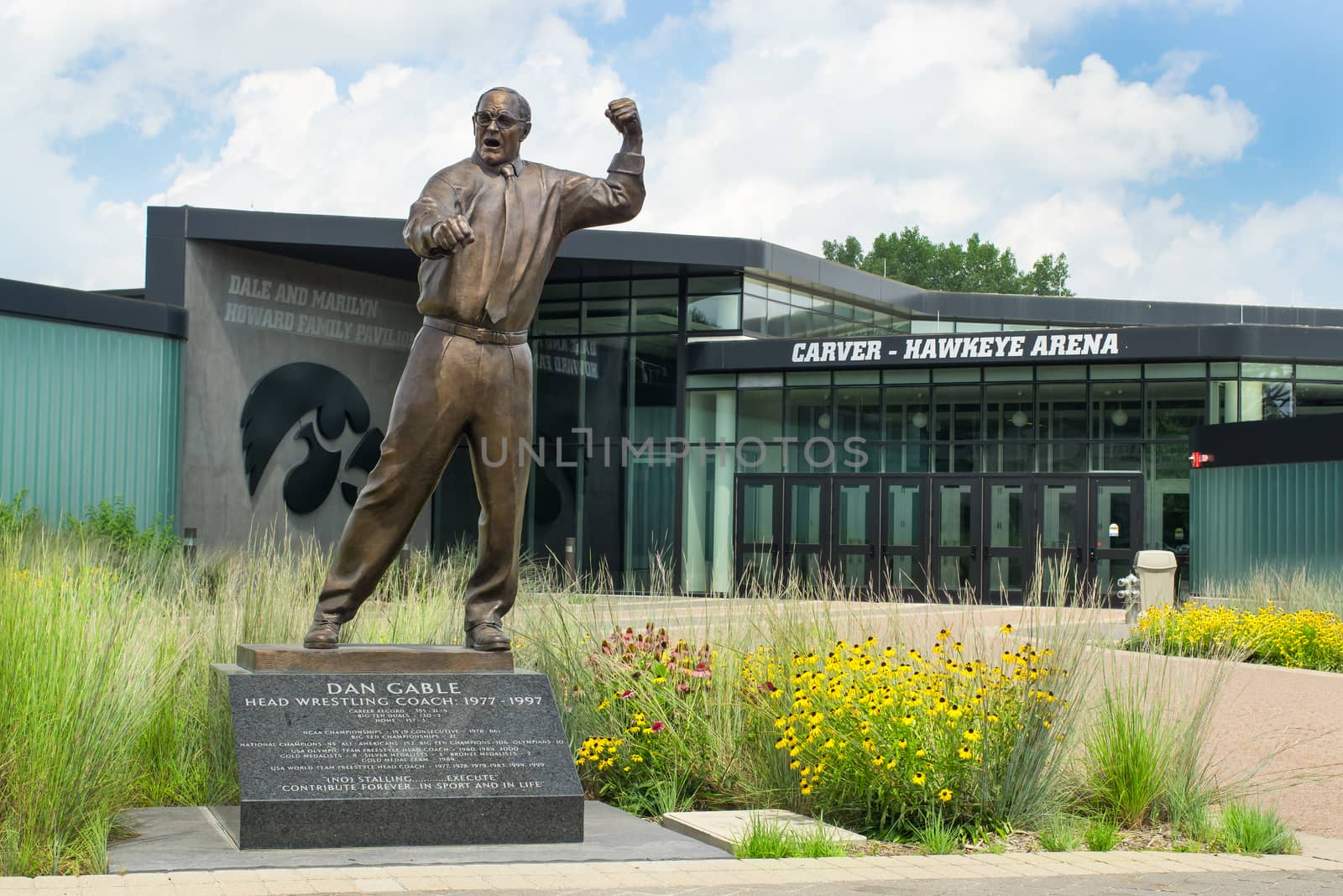 IOWA CITY, IA/USA - AUGUST 7, 2015: Dan Gable head wrestling coach statue at the University of Iowa. The University of Iowa is a flagship public research university.