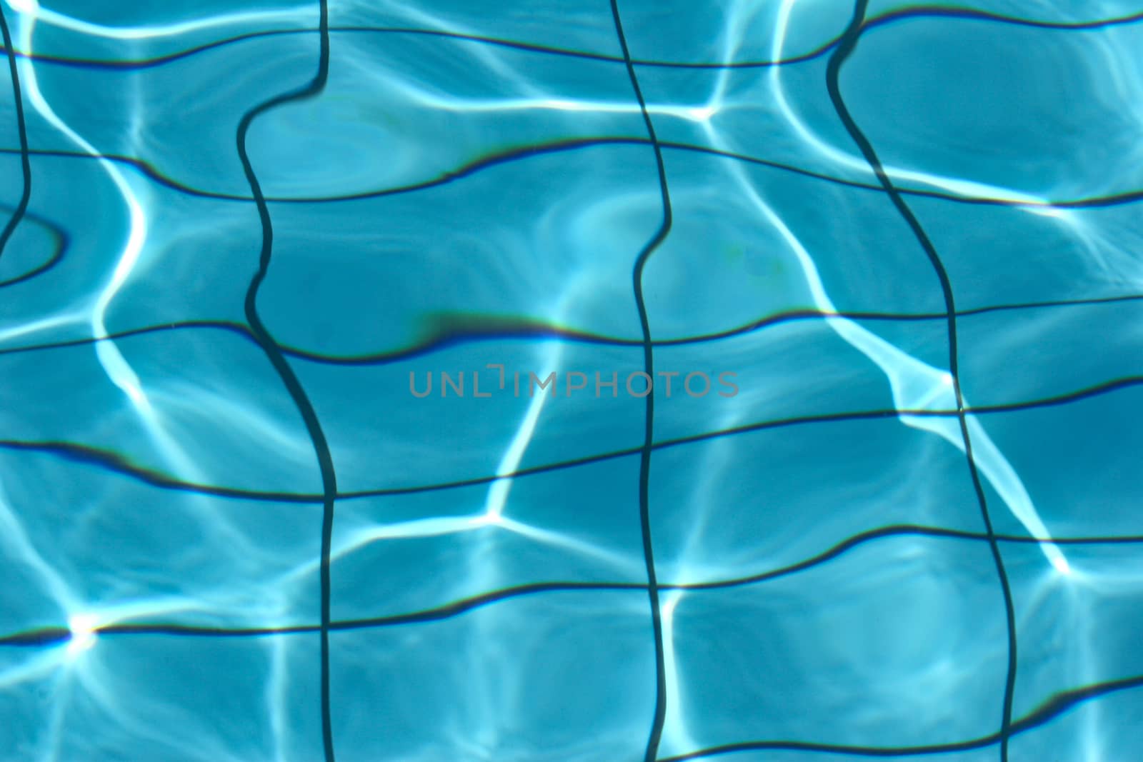 Blue water of a pool in greece in the sumer
