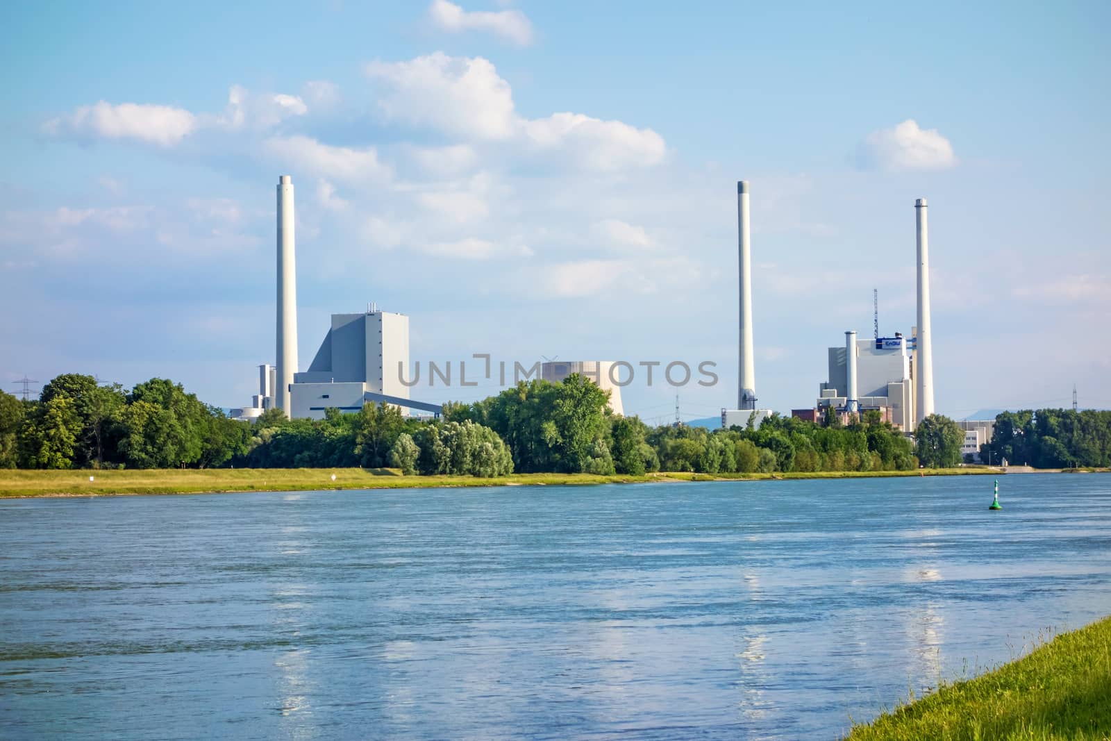 Karlsruhe, Germany - May 31, 2014: Steam power plant and hard coal-fired power station Rheinhafen-Dampfkraftwerk Karlsruhe EnBW, river Rhine in foreground.