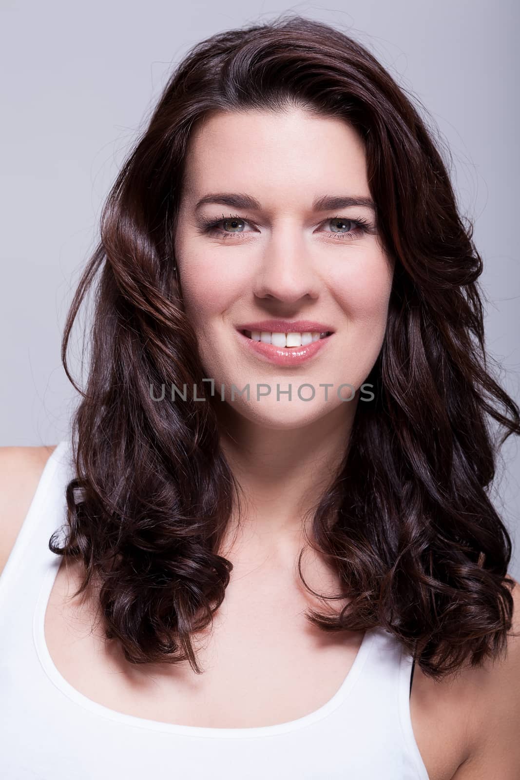 Portrait beautiful woman with dark hair smiling in the camera by juniart