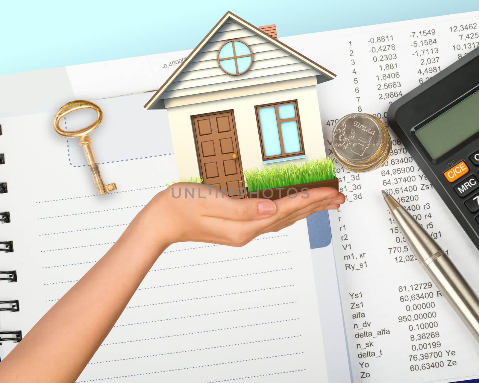 Humans hand holding house with key, pen and calculator
