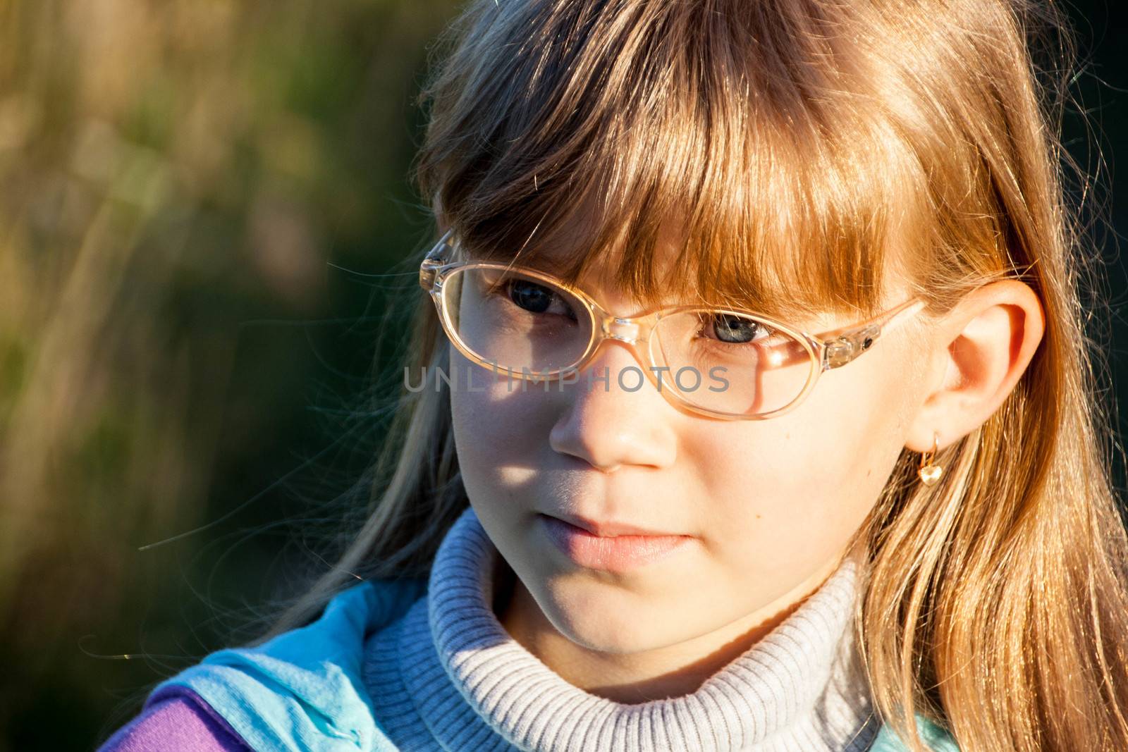 Smiling little blond girl with glasses by alexx60