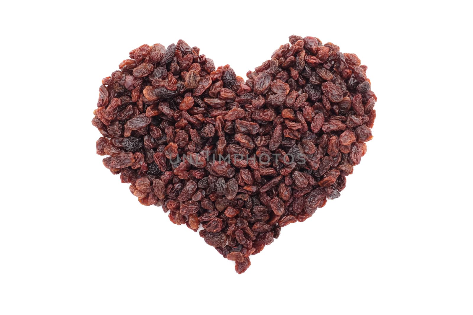 Raisins in a heart shape, isolated on a white background