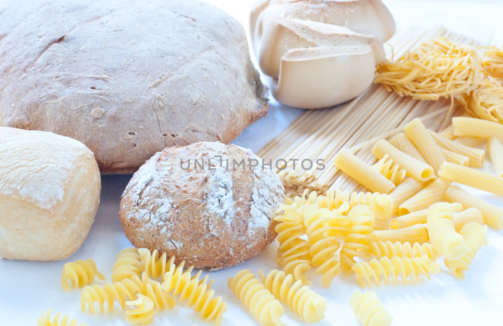 Different varieties of Italian pasta and homemade bread