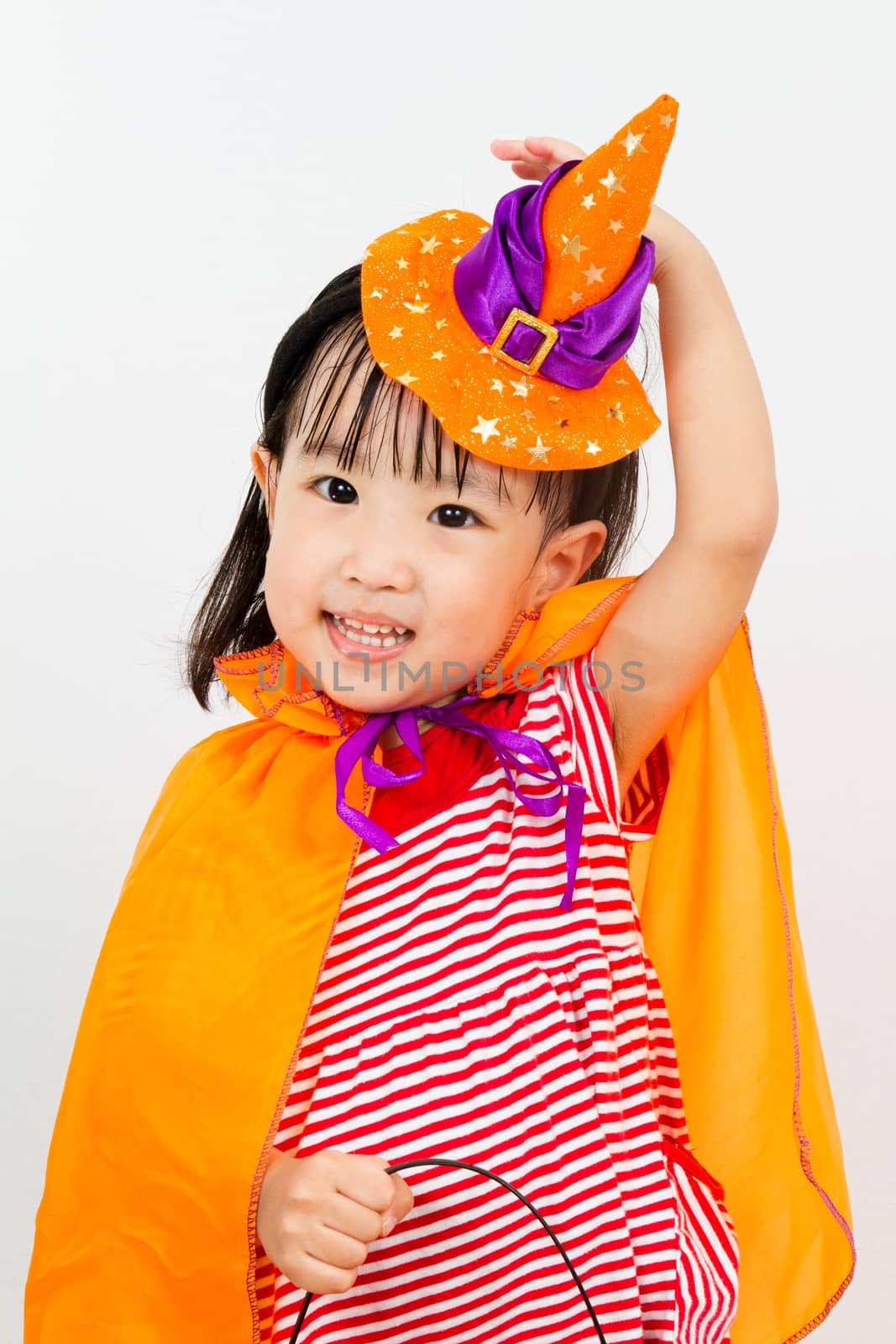 Asian Chinese Little girl celebrate Halloween studio shot.