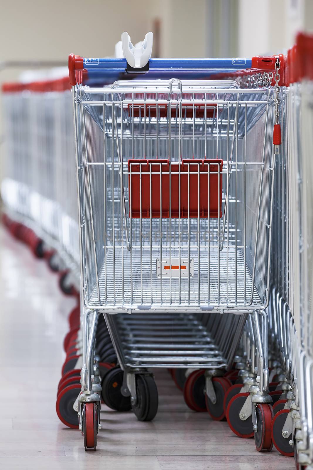 Row of Stacked Supermarket Trolleys by vwalakte