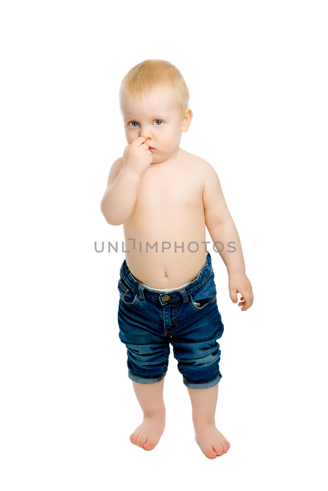 A little boy in a plaid shirt on white background in full length