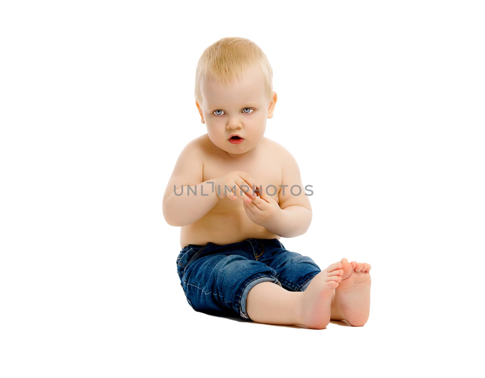 A little boy in a jeans on white background
