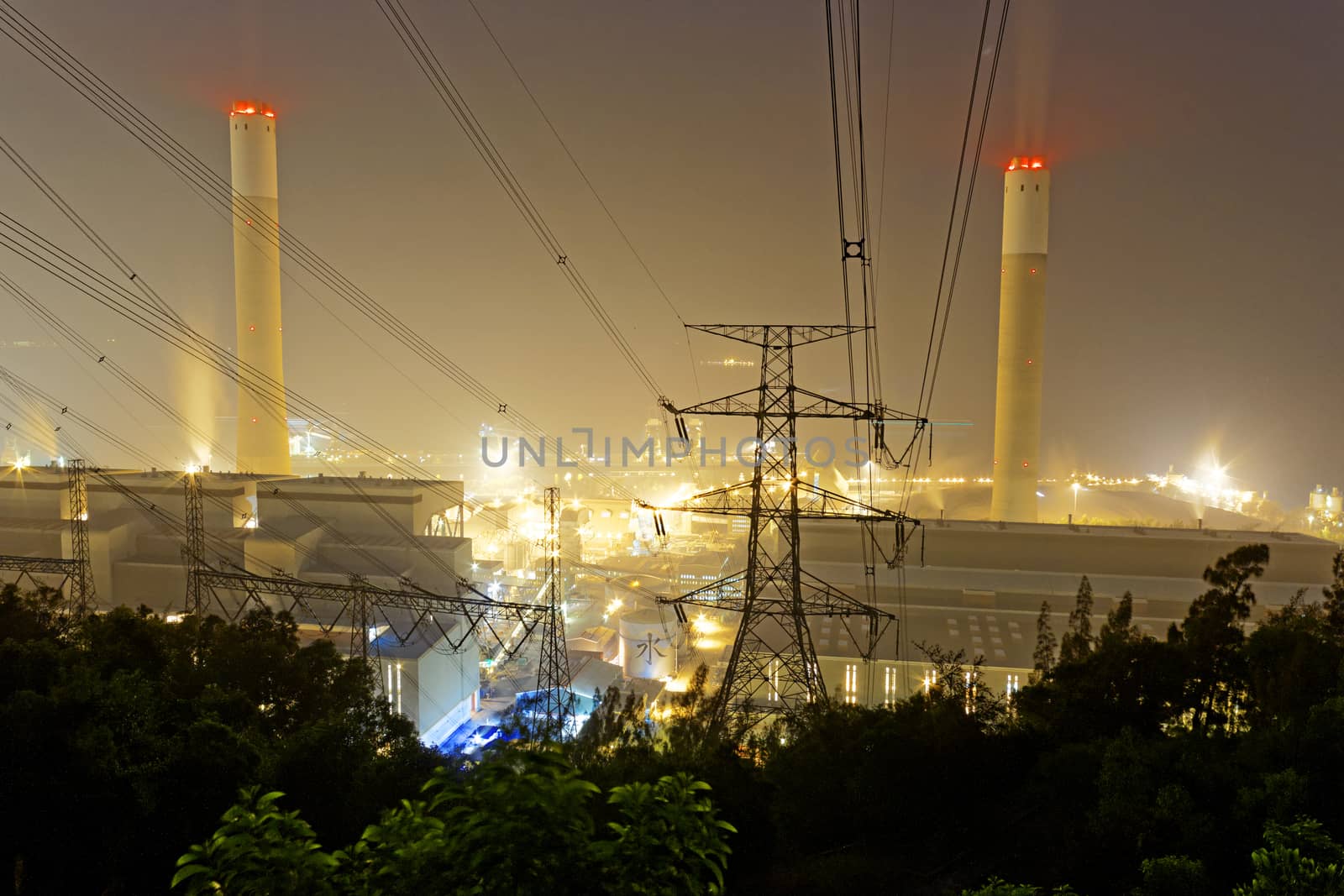 Power station with smoke at night