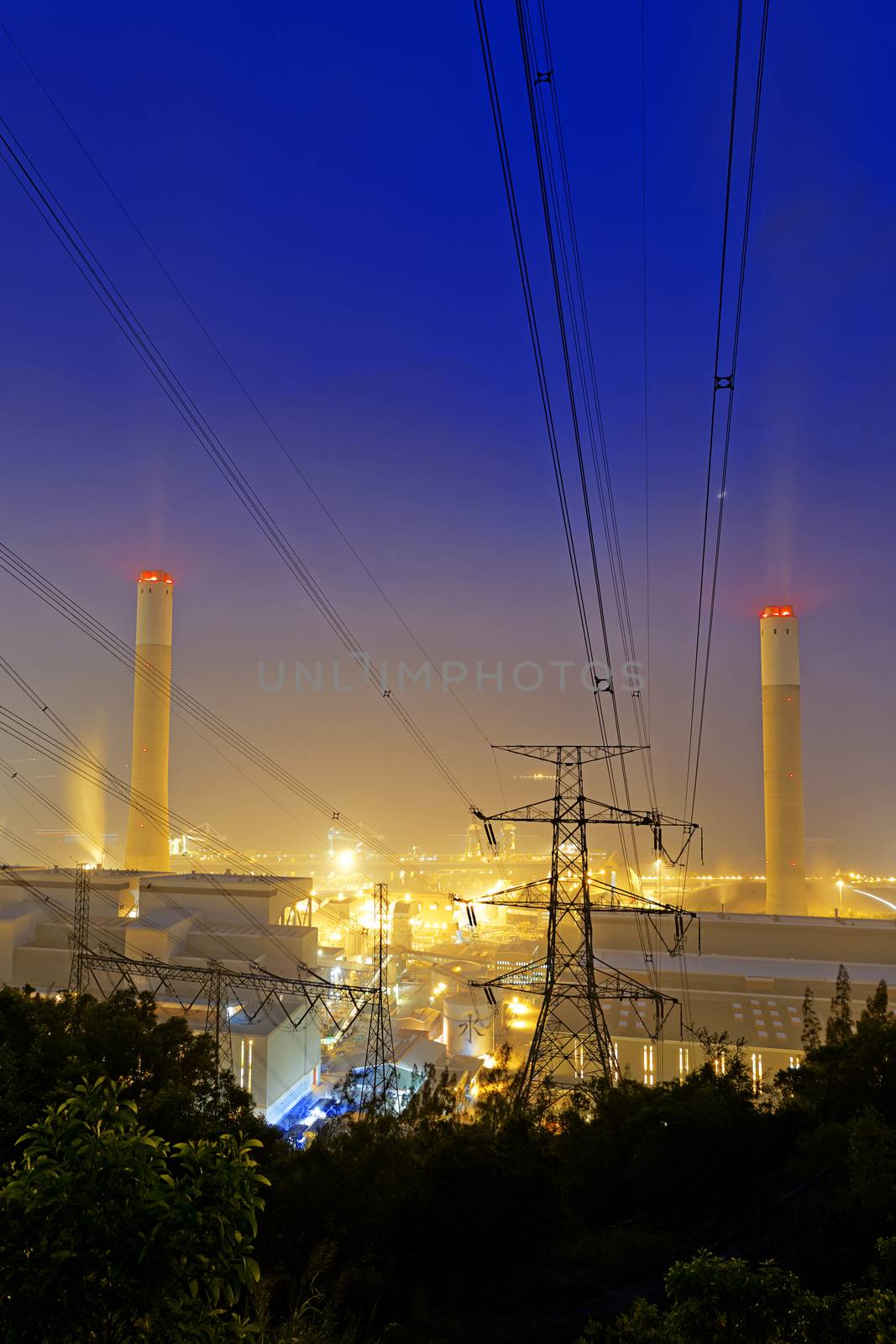 Power station with smoke at night