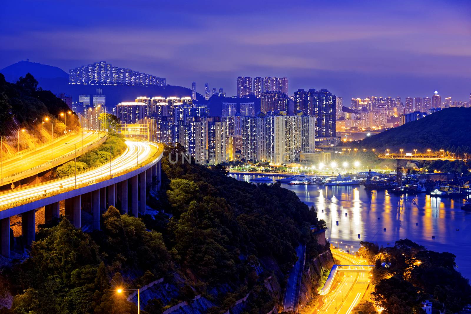 highway traffic road to city downtown at night, hong kong city