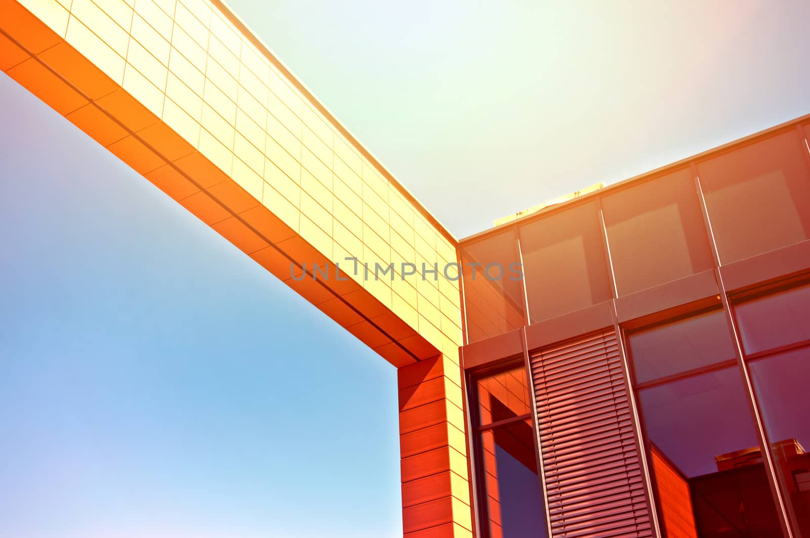 Business architecture. Picture of business office building with blue summer sky and sunlight.