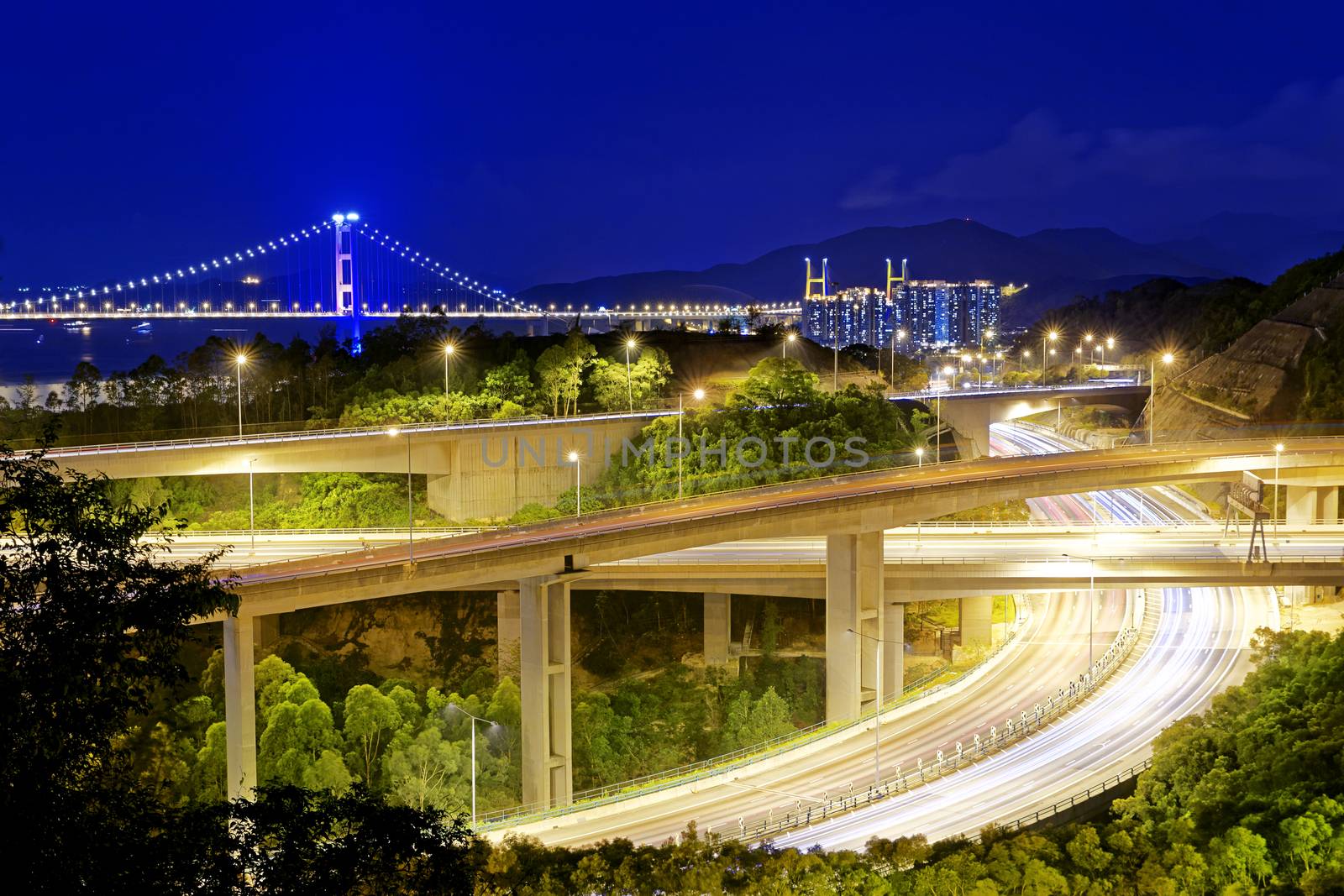 Highway traffic road and tsing ma bridge at night