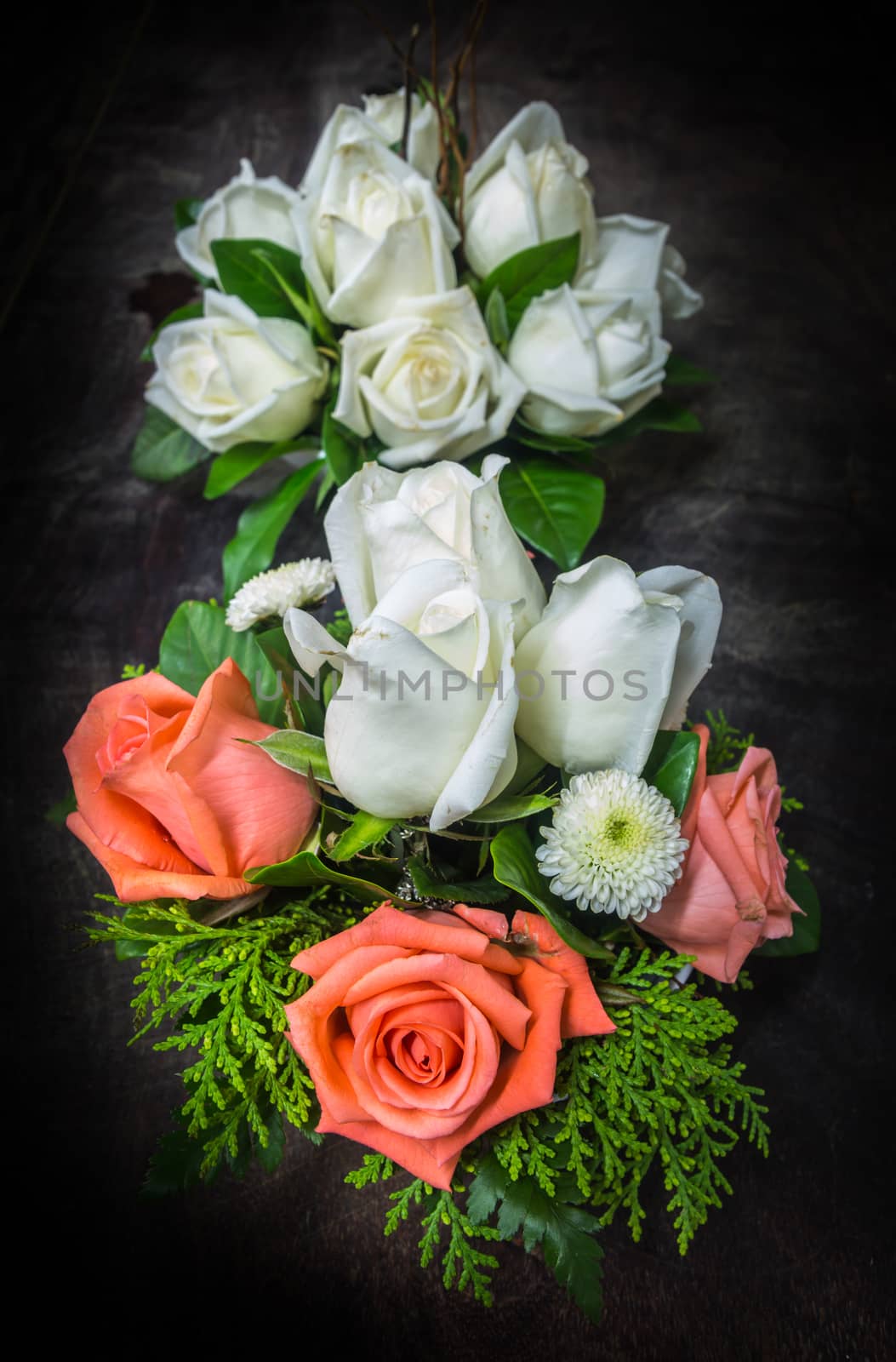 still life decorated orange and white roses