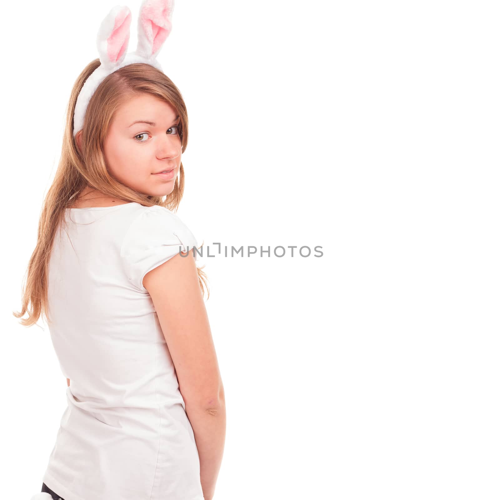 beautiful young woman wearing cute bunny ears looking a the camera