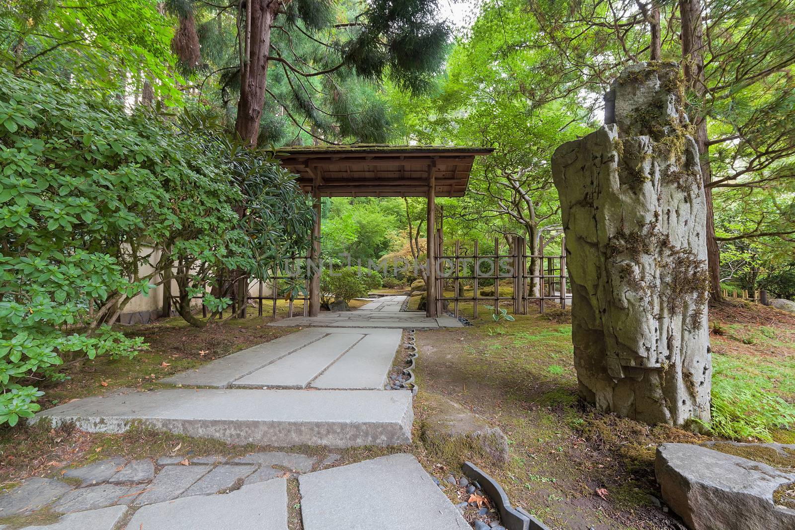 Stone Path with Wood Entry Structure and Landscaping Rocks at Japanese Garden