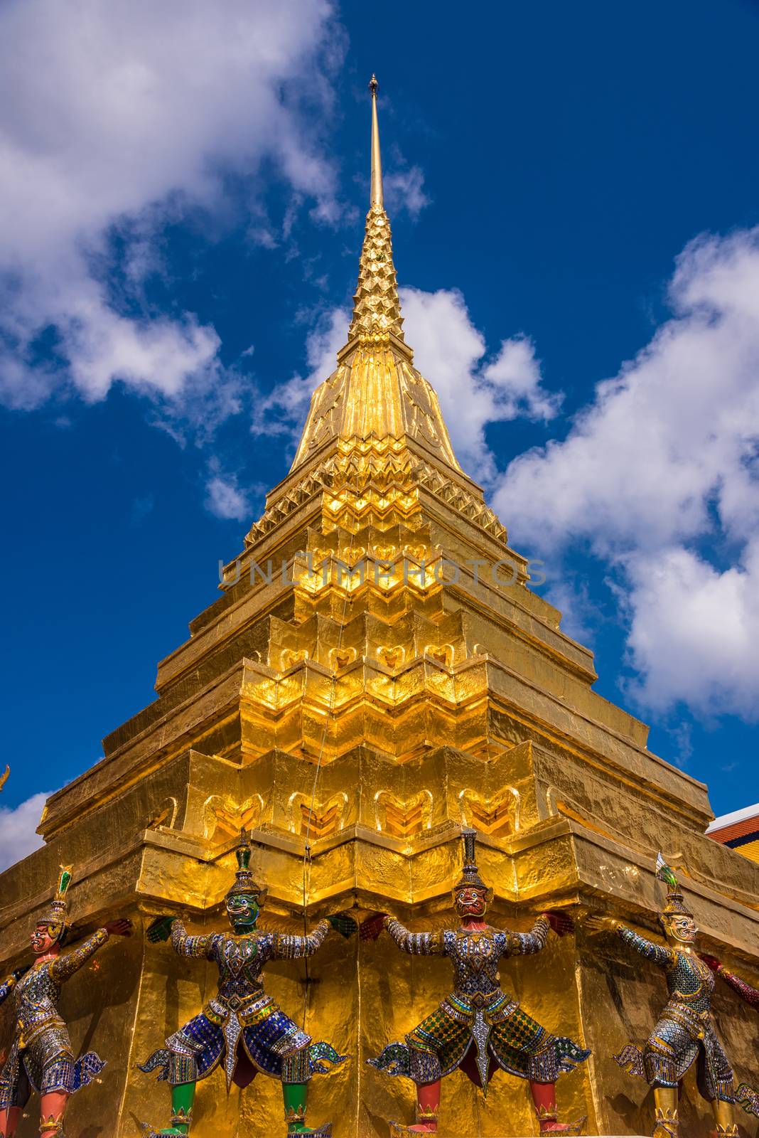 Demon warriors guarding the golden temple dome at Grand Palace of Bangkok.
