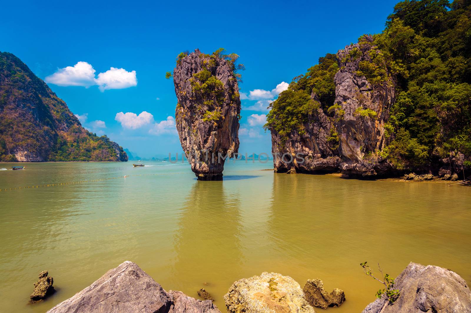 Khao Phing Kan featuring the 20m tall islet known as Ko Tapu in Phang nga bay in thailand. It is also known as the James Bond island after the 1974 James Bond movie - The Man with the Golden Gun was shot here.