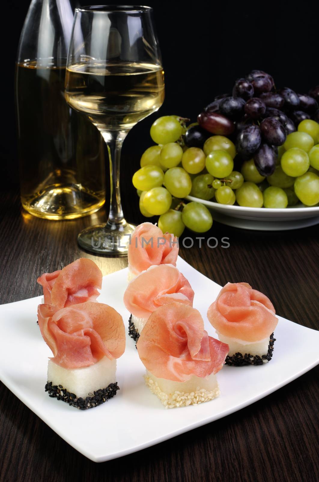 Canape melon in sesame with gammon by Apolonia