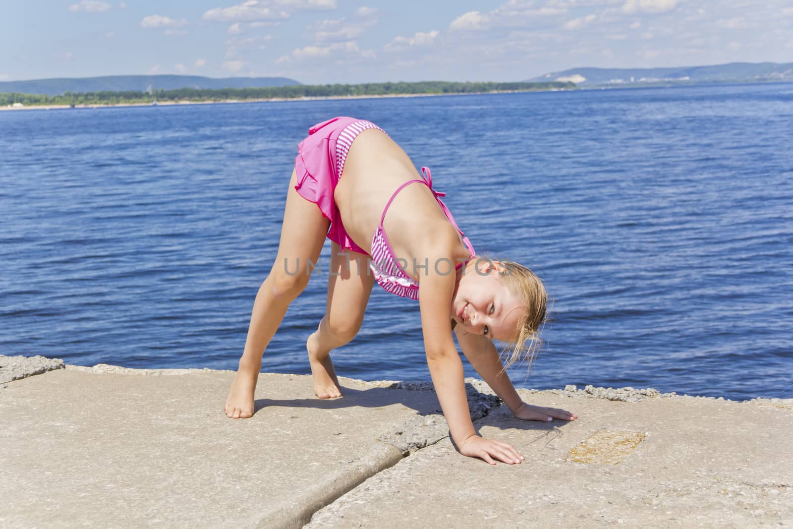 Girl practices yoga by Julialine