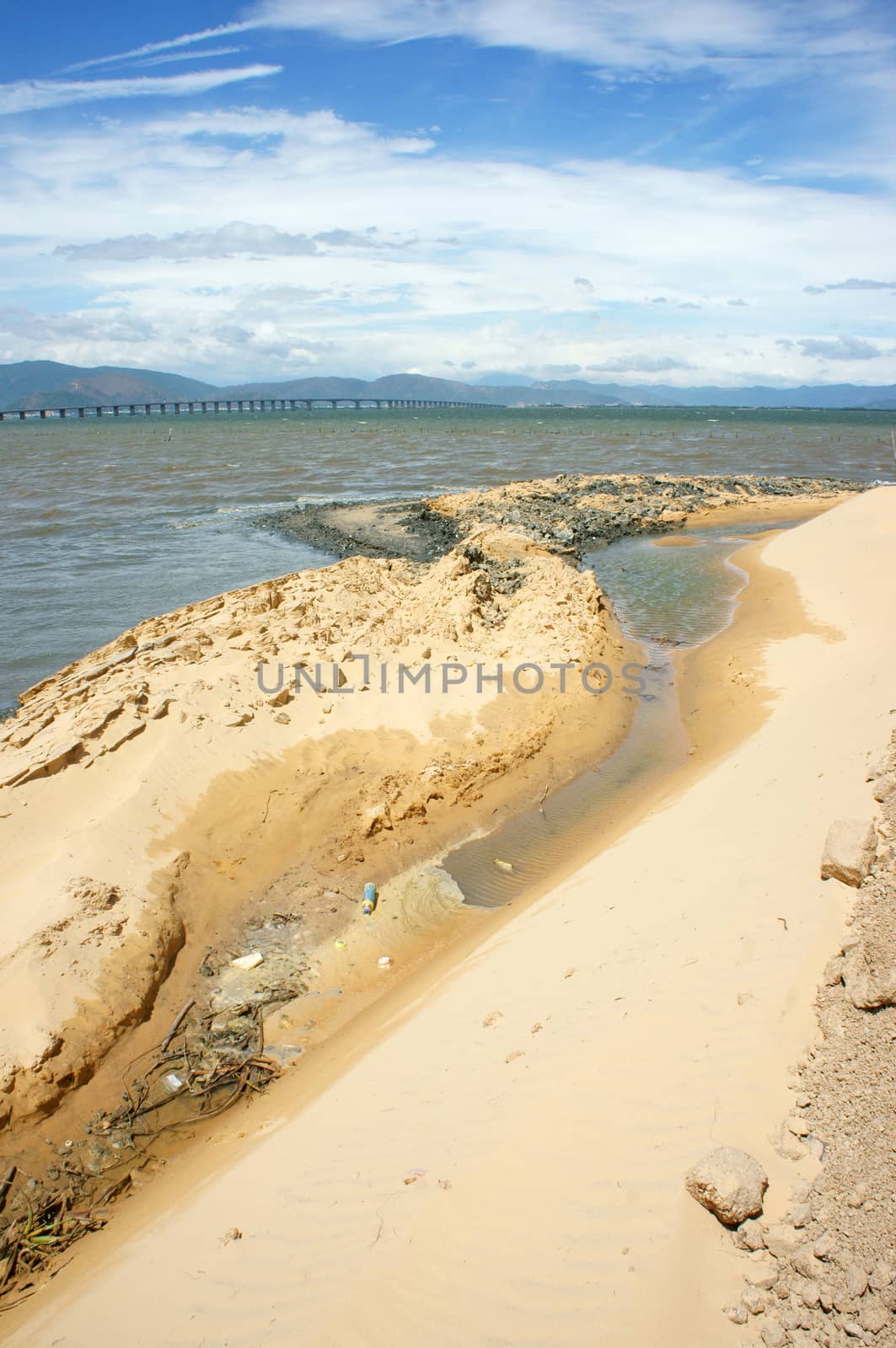Reclamation project at Quy Nhon, Binh Dinh, Viet Nam, fill up sand on water to make construction plan, try to change nature for human profit, fill soil at seaside