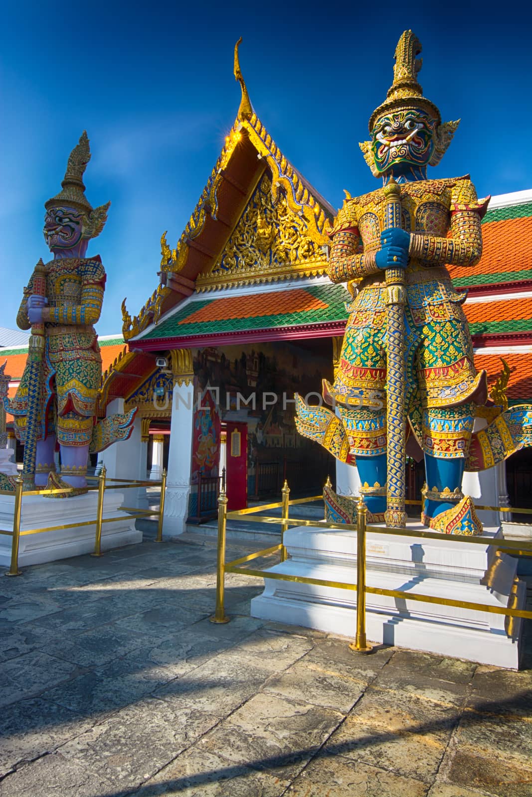 Giant guardians to an entrance in Wat Phra Kaew, Bangkok Thailand.