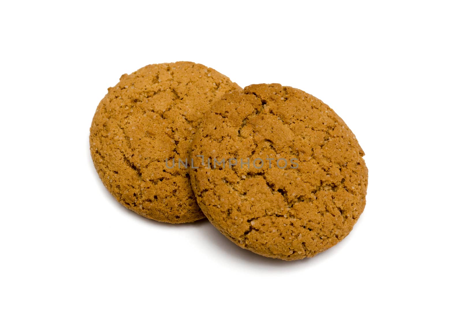 Two oat cookies closeup on white background