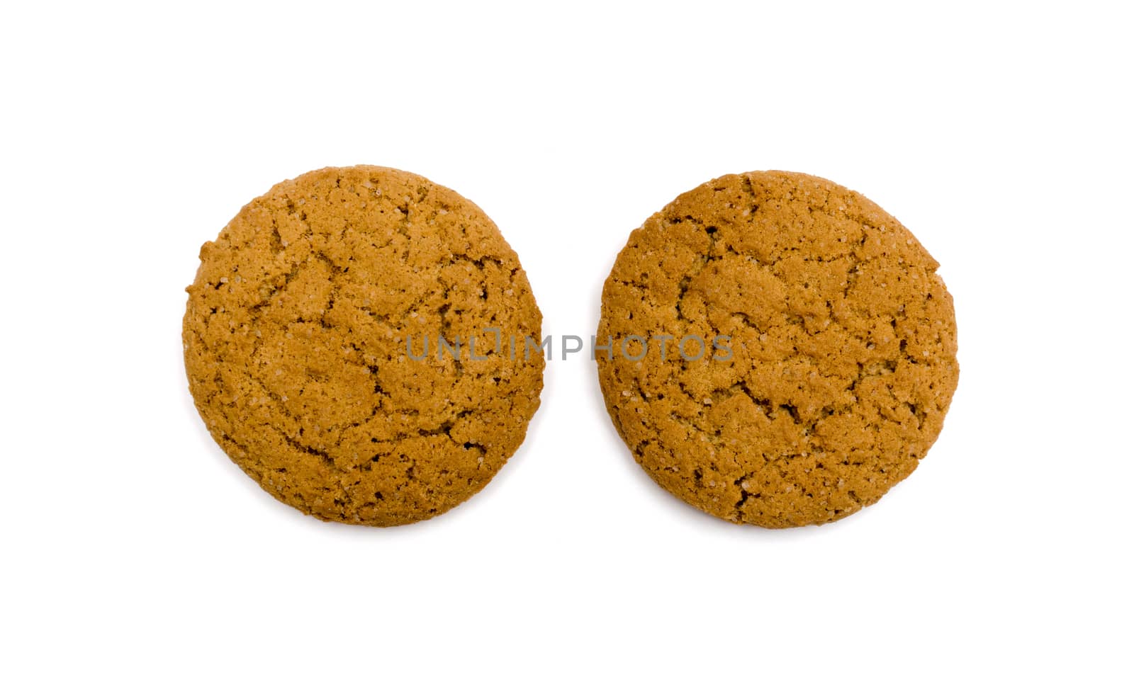 Two oat cookies closeup on white background by DNKSTUDIO