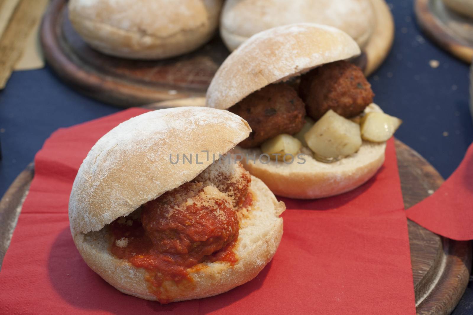 sandwiches with meatballs. potatoes and tomatoes