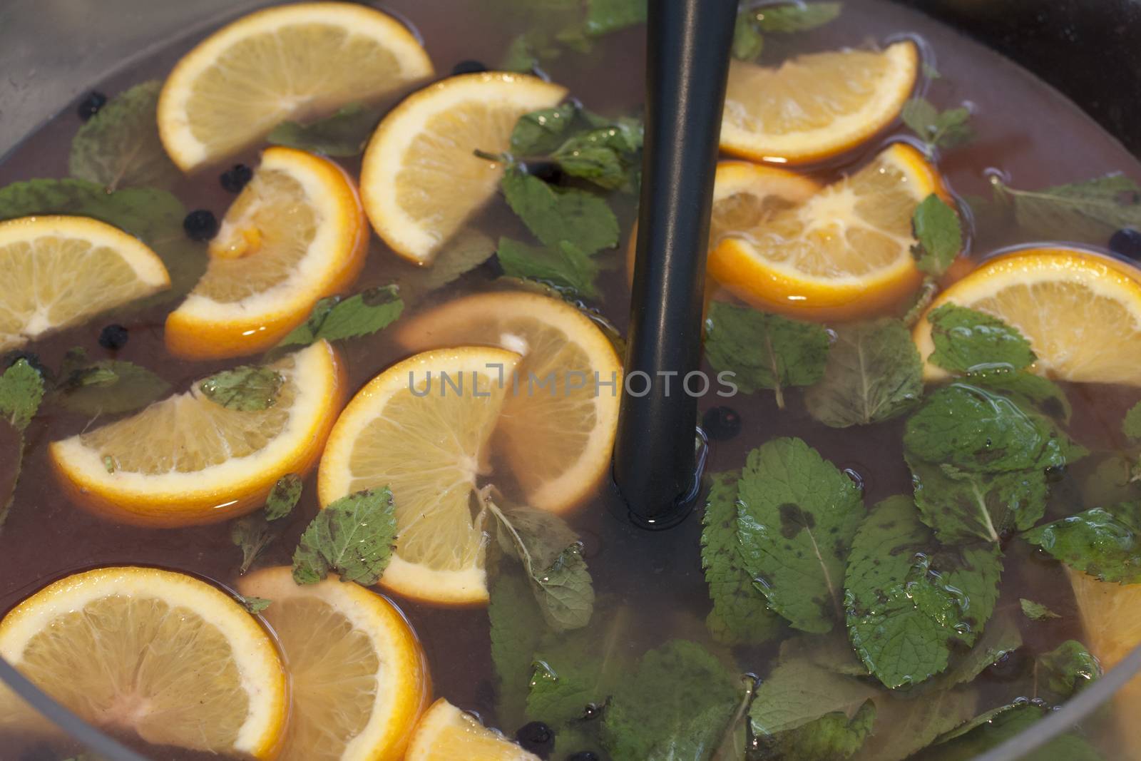 new sangria made with orange slices and mint leaves