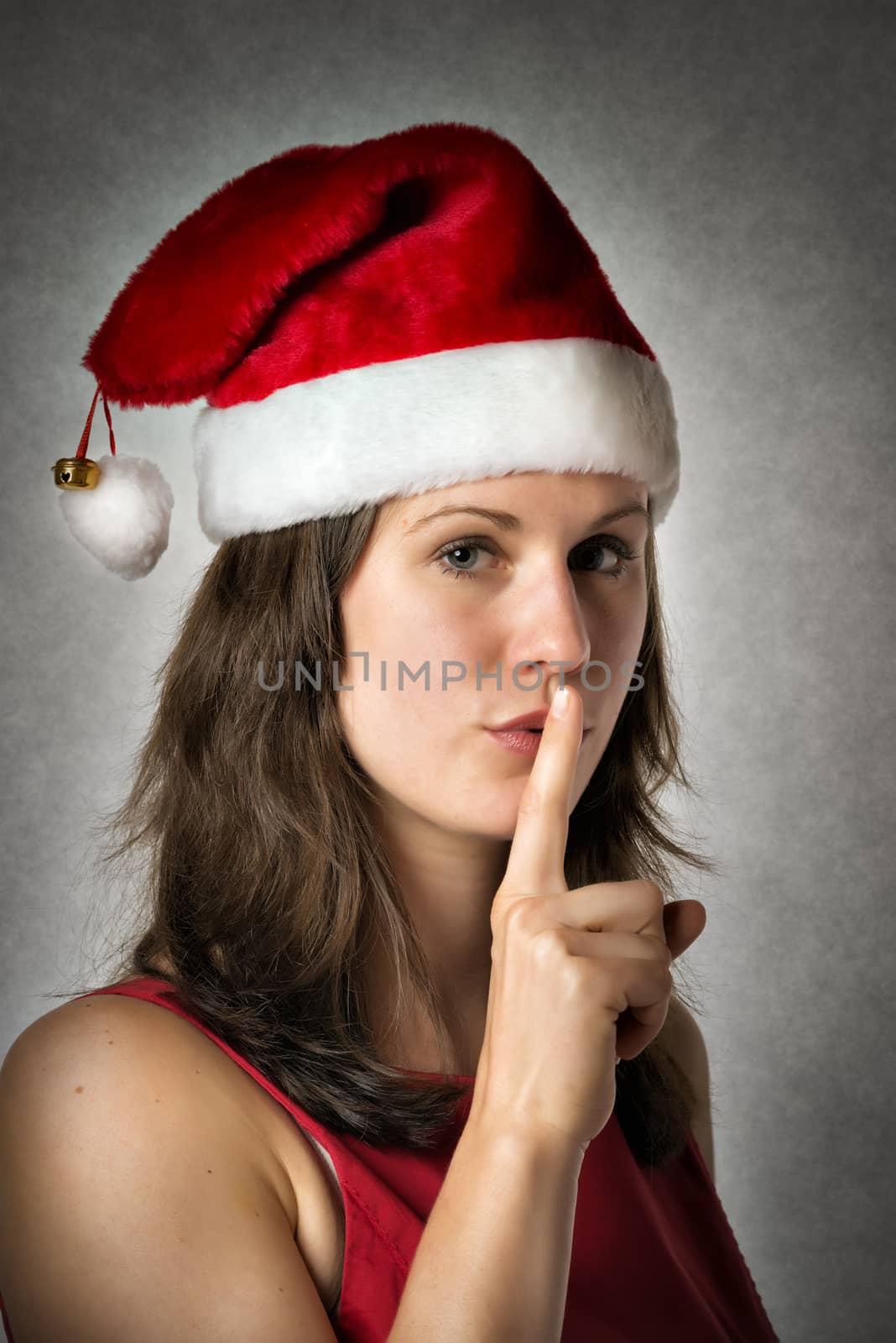 Portrait of a smiling woman wearing Santa Claus costume