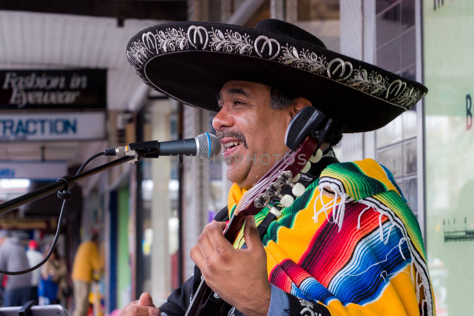 Mexican Musician Busking on the Street by davidhewison