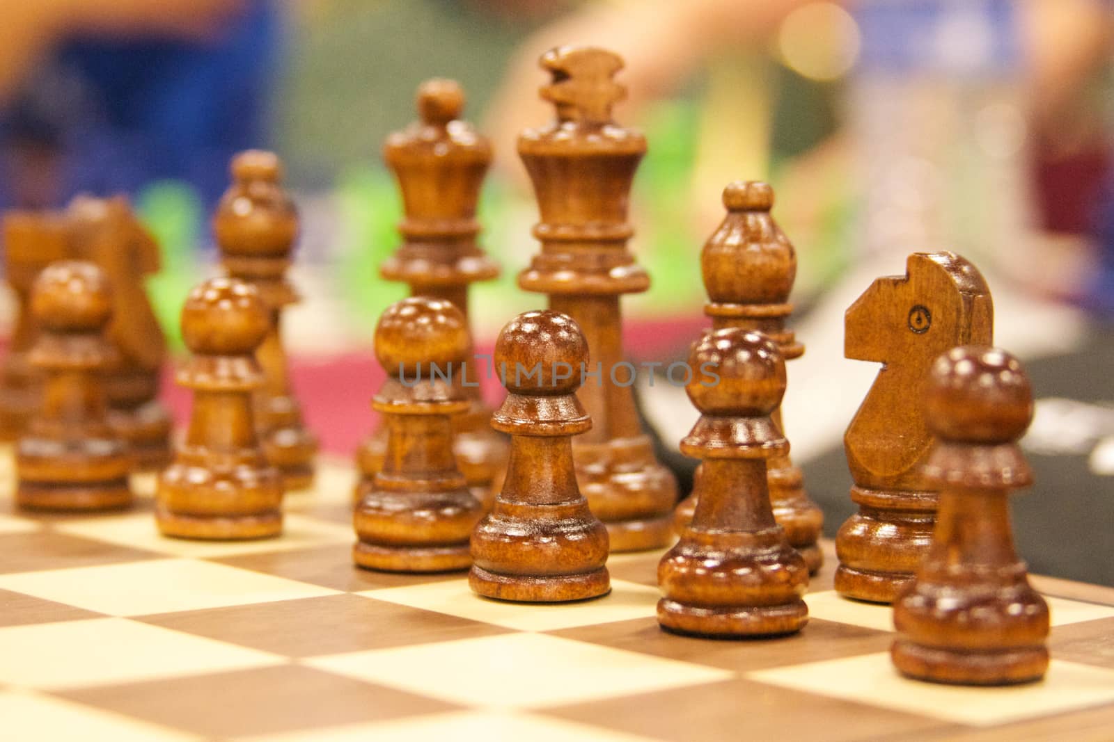 a wooden chess set stands ready for battle