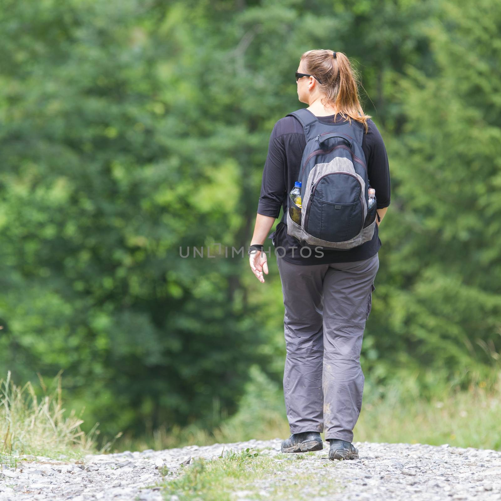 Hiker, young woman with backpack by michaklootwijk