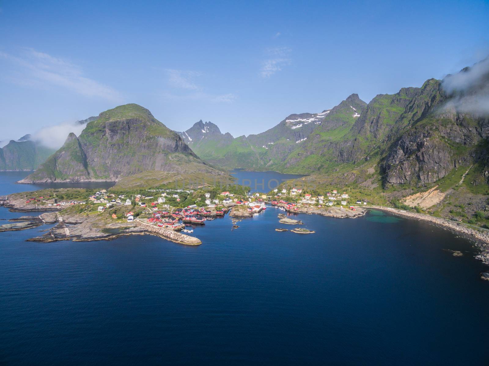 Aerial view of scenic fishing village A on Lofoten islands in Norway with traditional red fishing huts