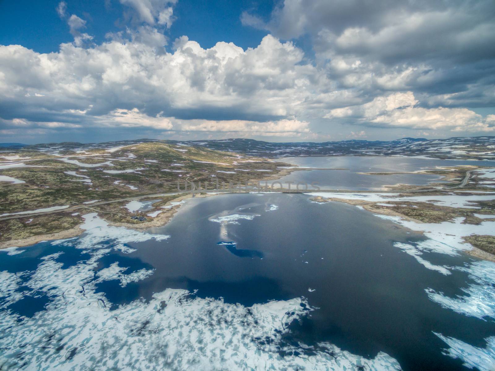 Aerial scenic view of icy lake in Norway, Hardangervidda