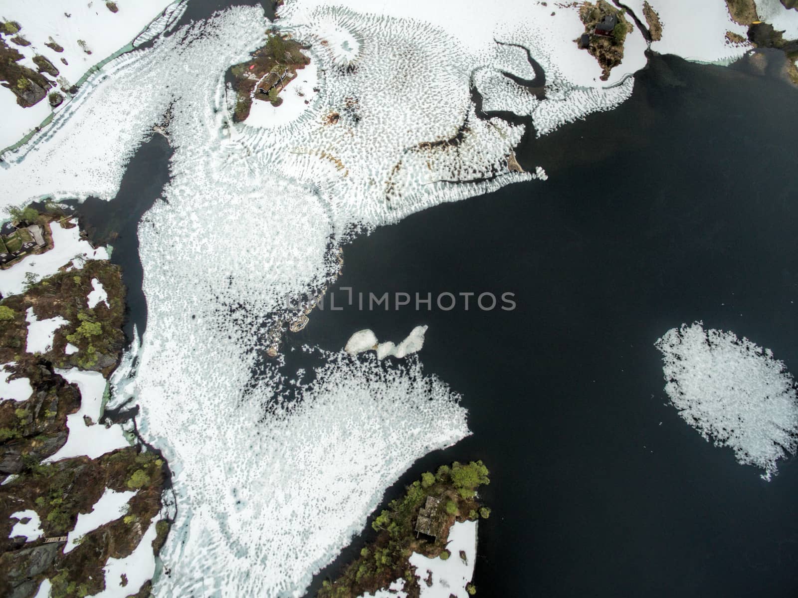 Scenic aerial view of partly frozen lake in norwegian mountains, Ryfylke region