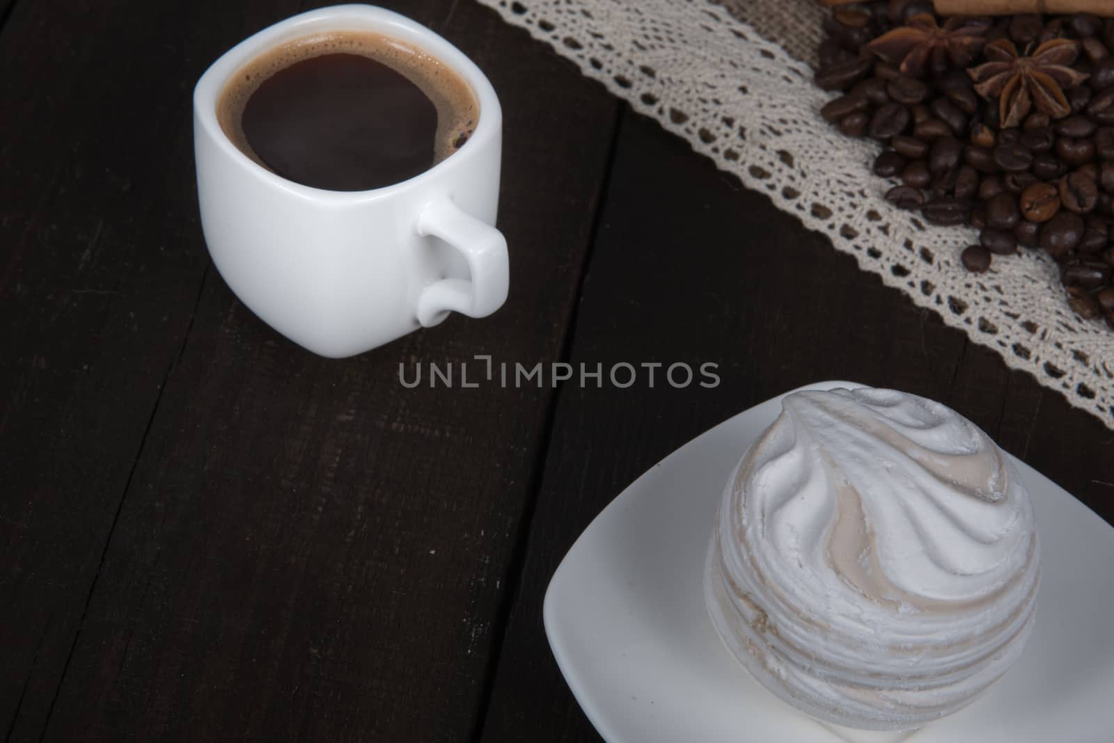 black coffee with cinnamon and star anise next Cup and marshmallows