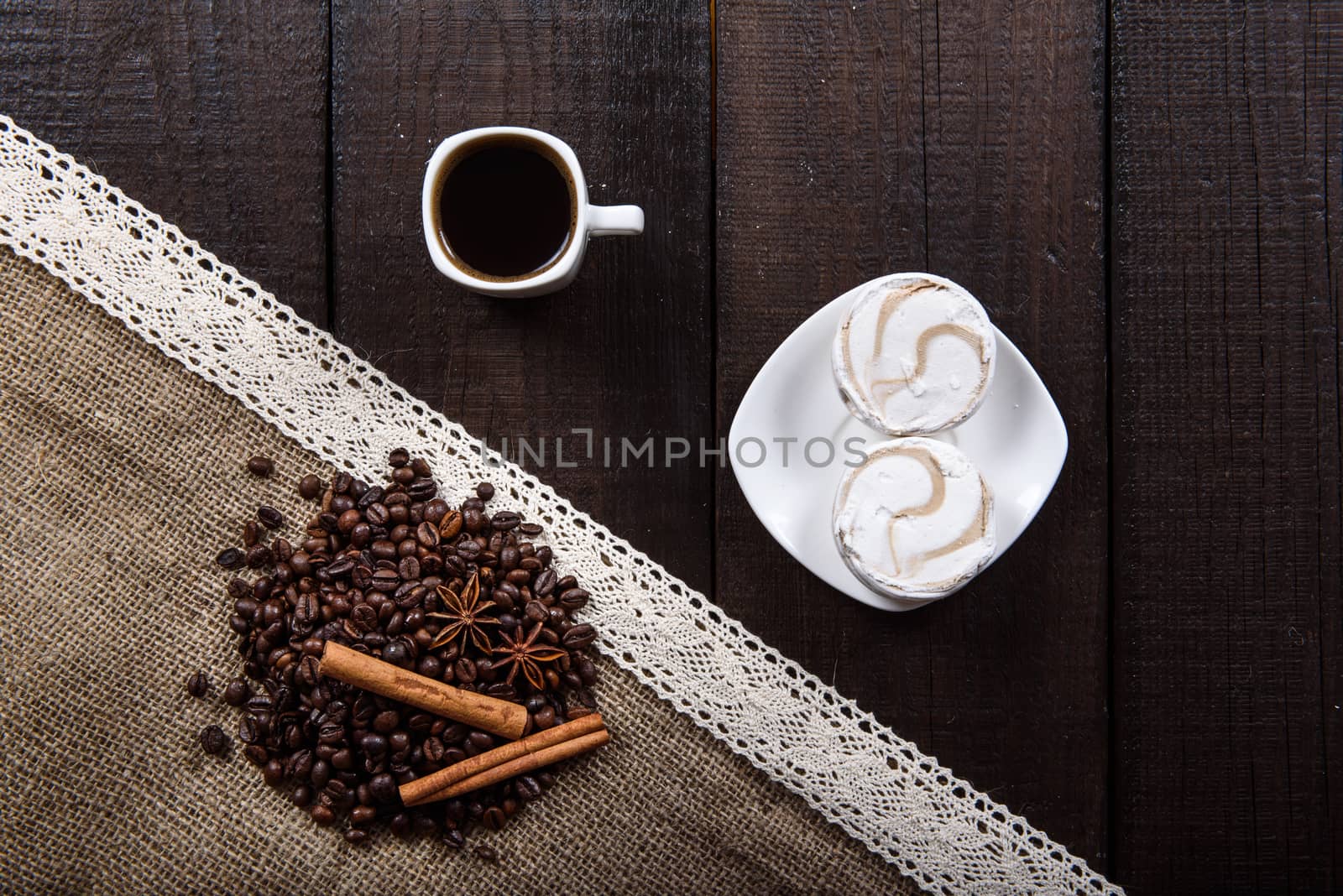 black coffee with cinnamon and star anise next Cup and marshmallows