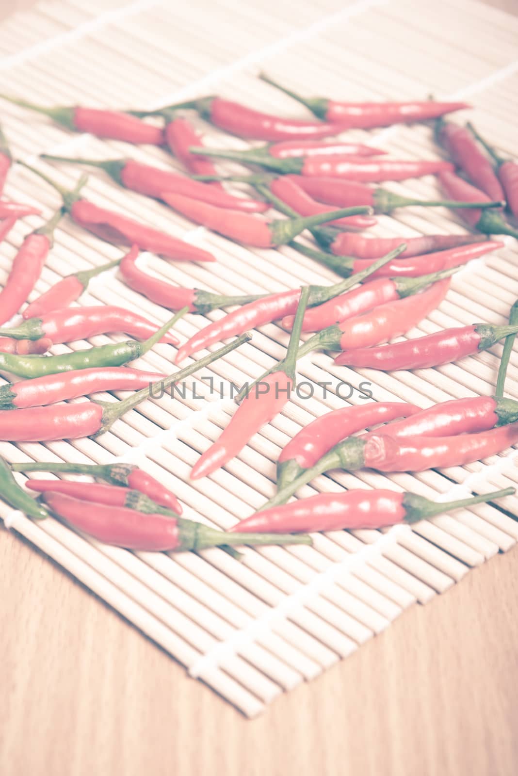 red chili peppers on wood table background vintage style