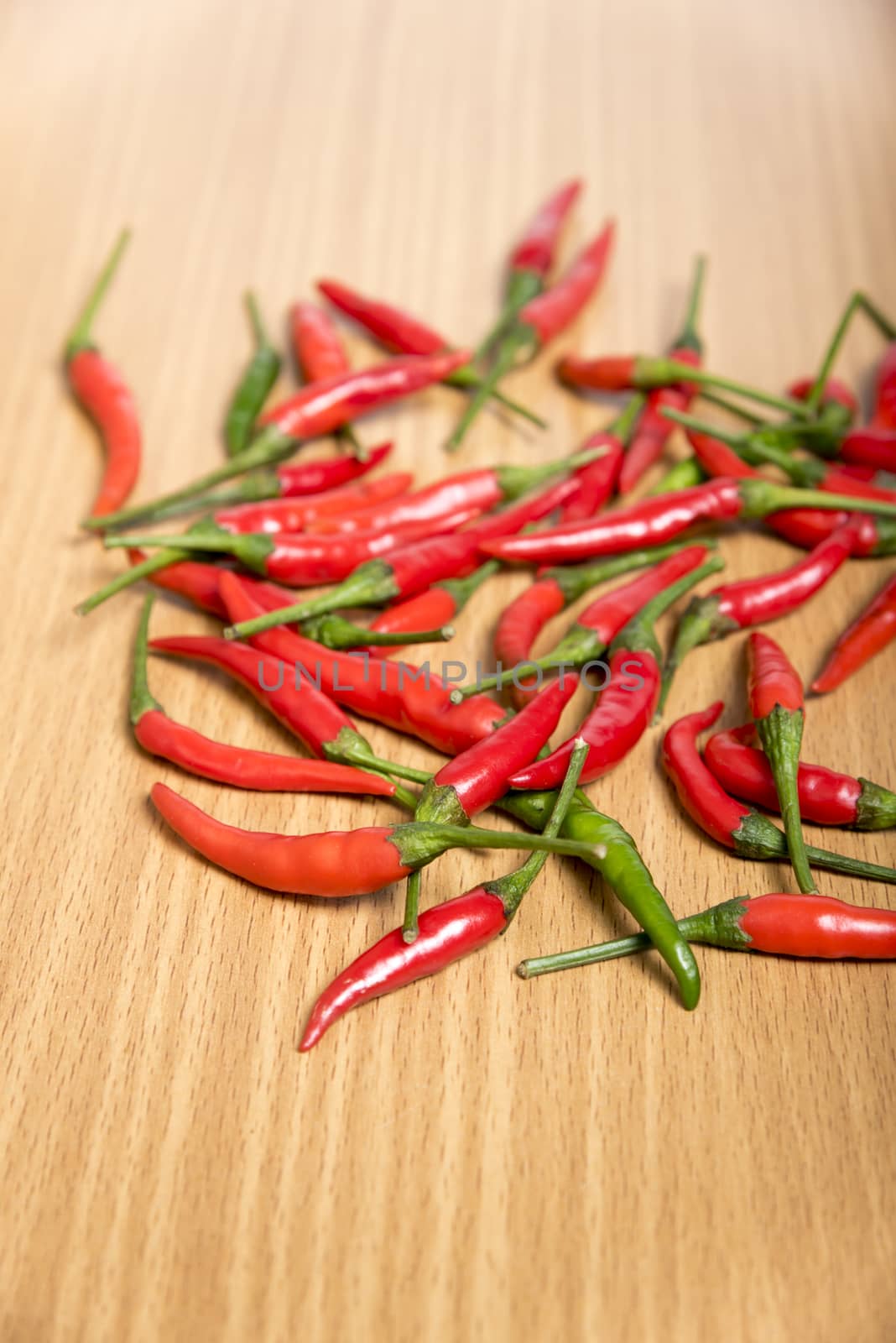 red chili peppers on wood table background