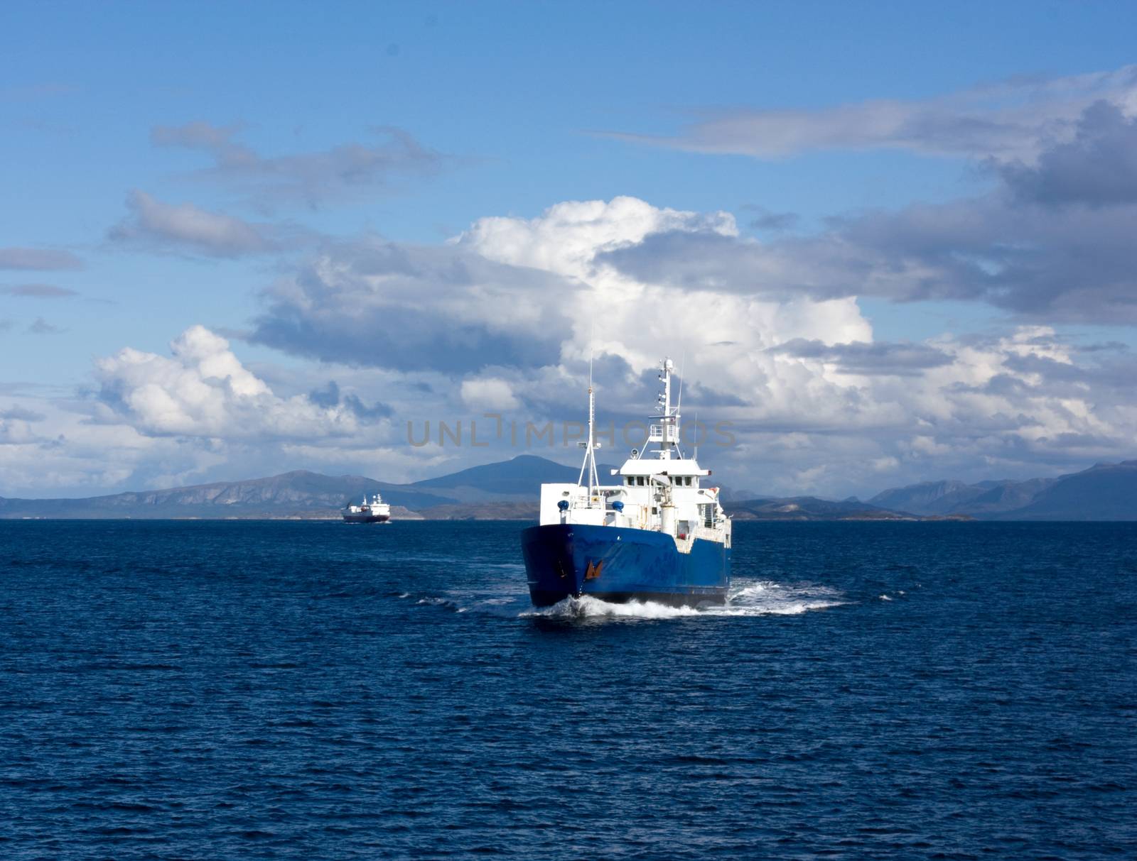 Fishing boat and passenger boat by the Norwegian coast